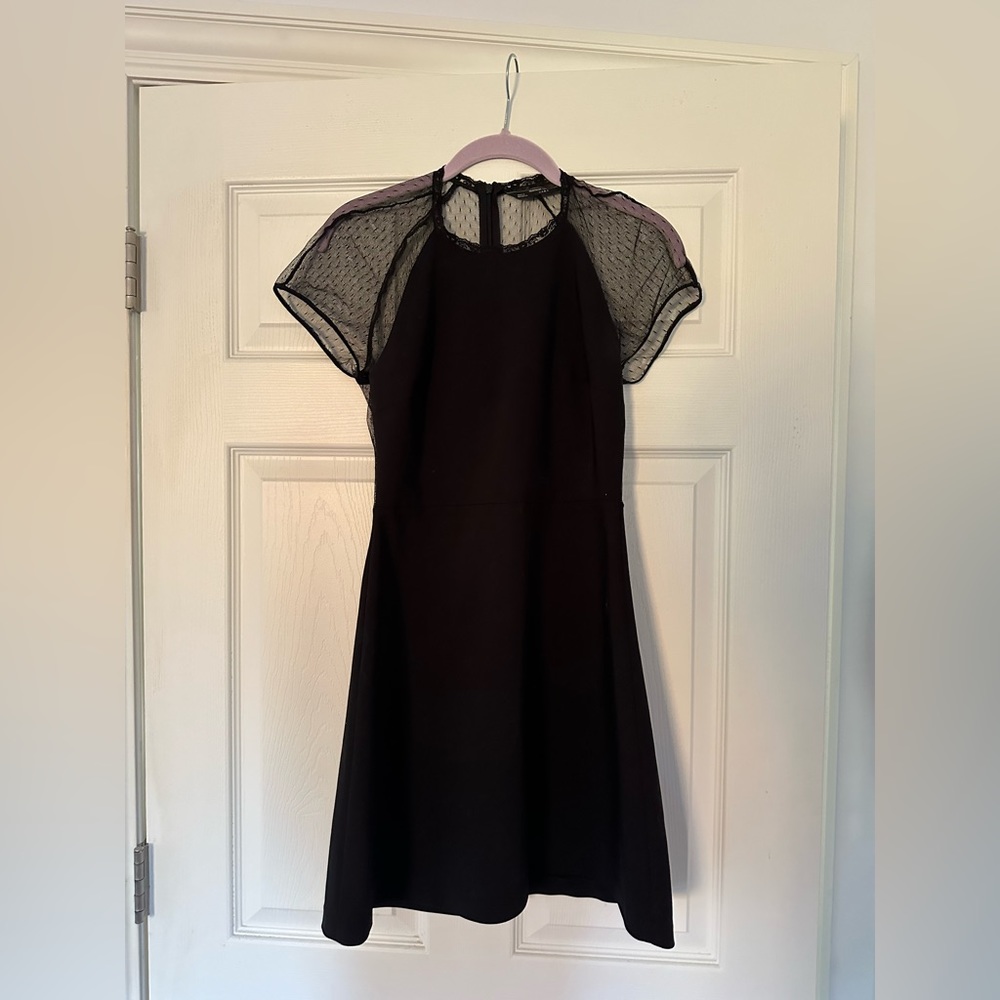 Little black dress with sheer polka dot back